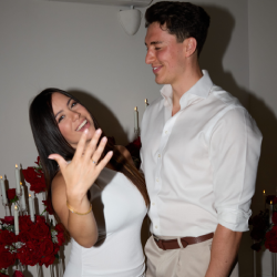The bride-to-be shows her engagement ring